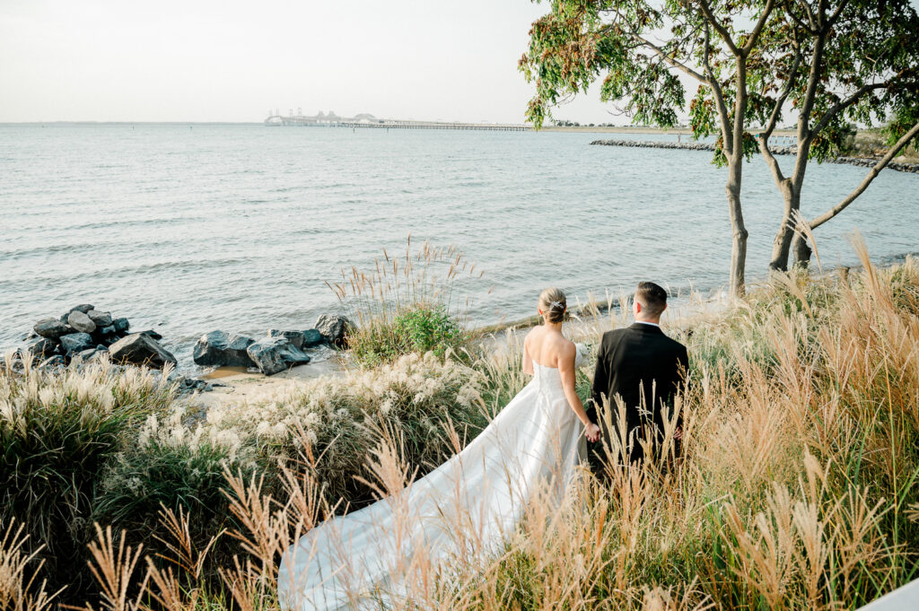 A classic, elegant waterfront wedding with gold bridesmaid dresses on the Chesapeake Bay in Maryland.