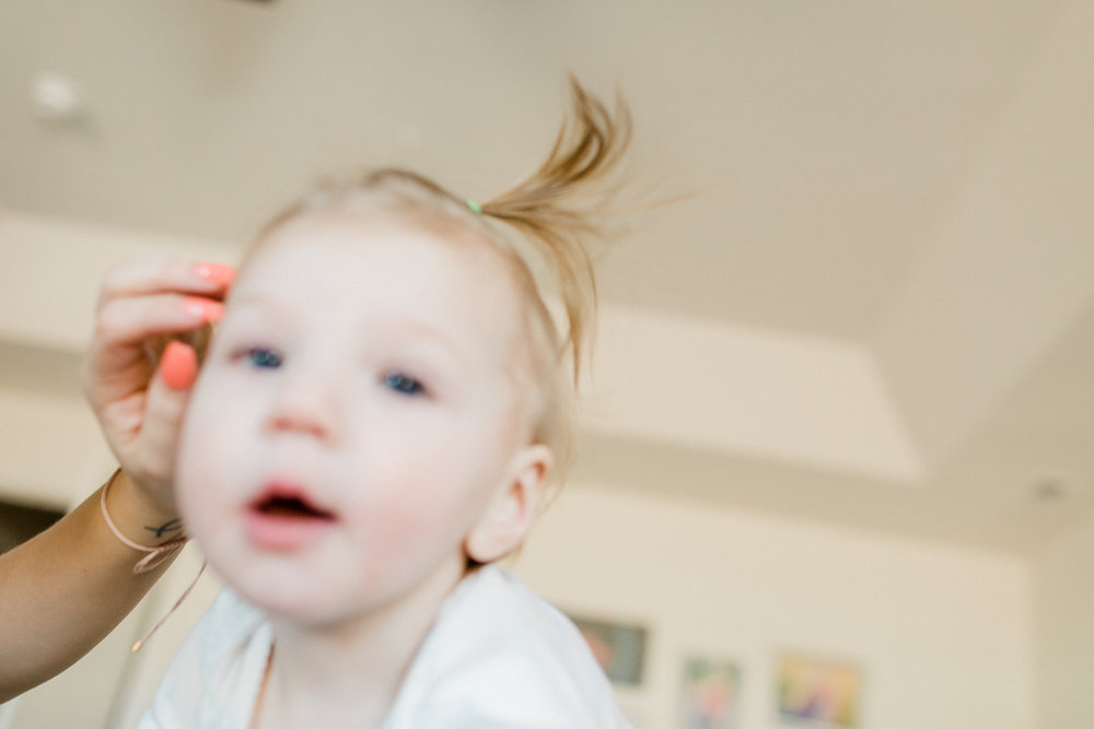 3 year old photographer taking pictures of her family