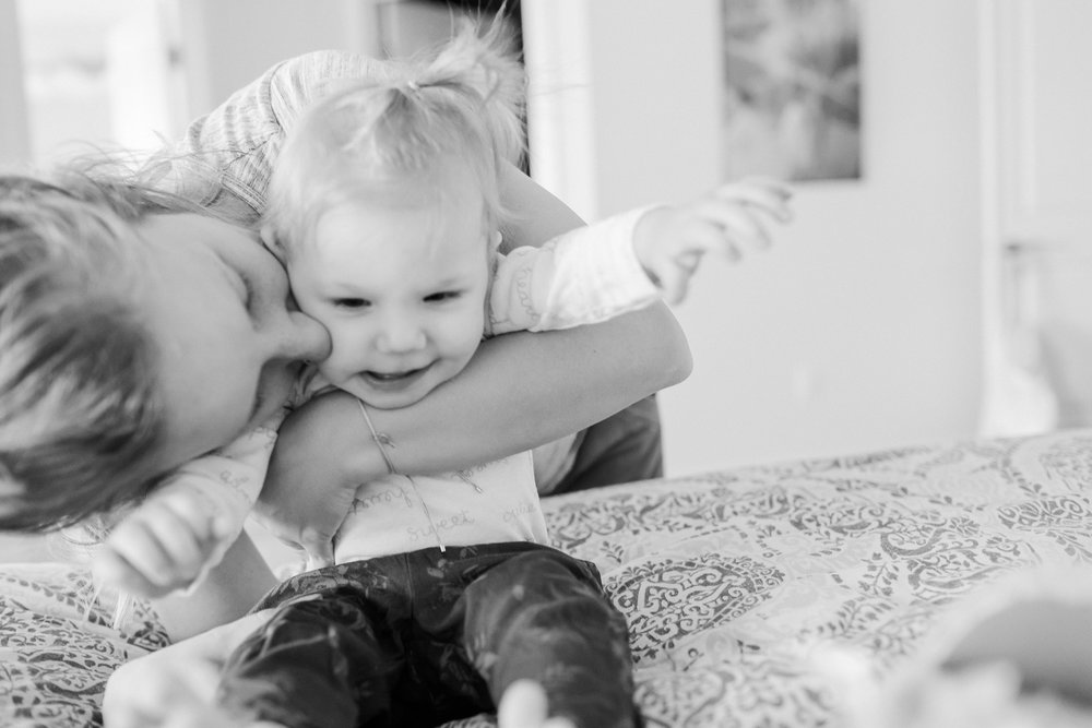 3 year old photographer taking pictures of her family