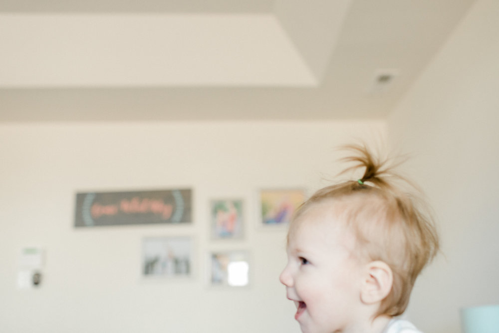 3 year old photographer taking pictures of her family