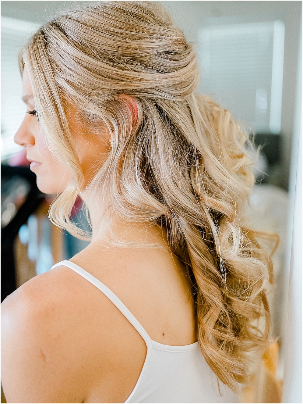 A playful Annapolis backyard wedding on the water featuring twinkle lights and greenery.