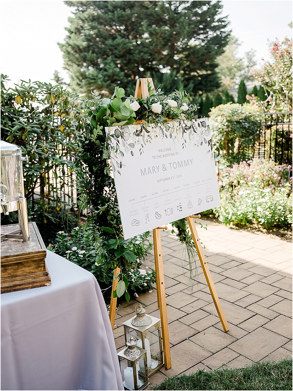 A playful Annapolis backyard wedding on the water featuring twinkle lights and greenery.