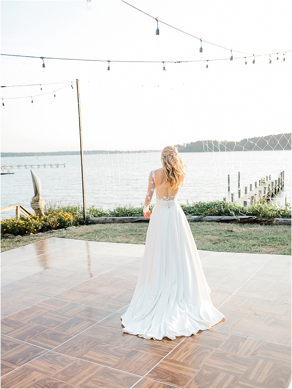 A playful Annapolis backyard wedding on the water featuring twinkle lights and greenery.