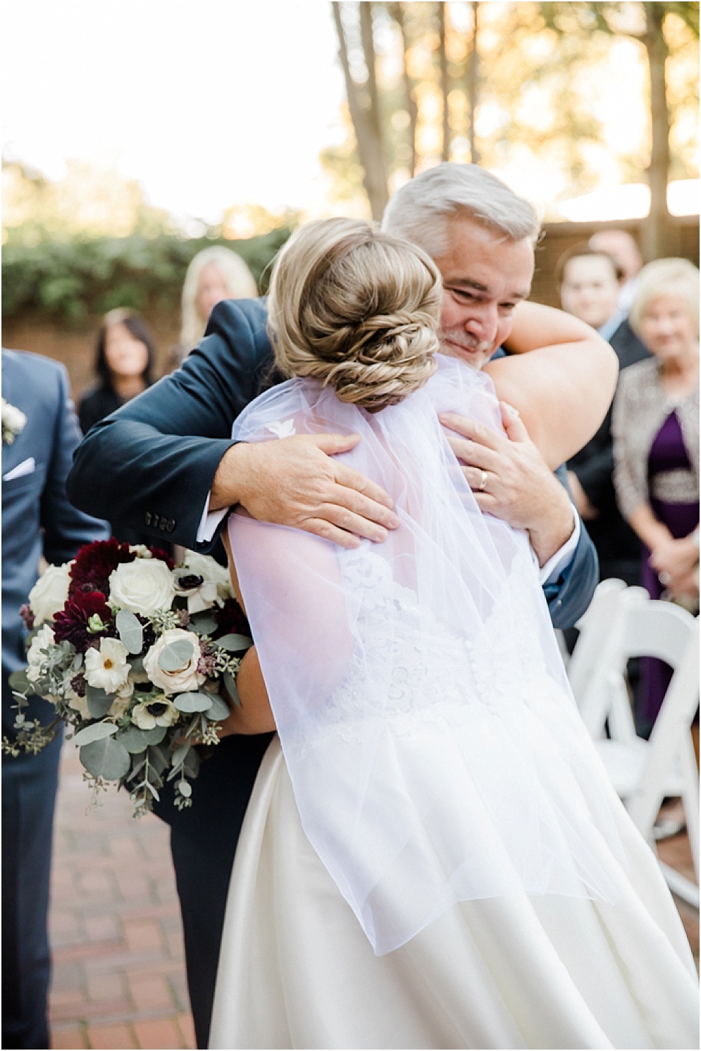 An Eastern Shore wedding in Downtown Easton, featuring deep red and purple hues and an incredibly joyful couple.