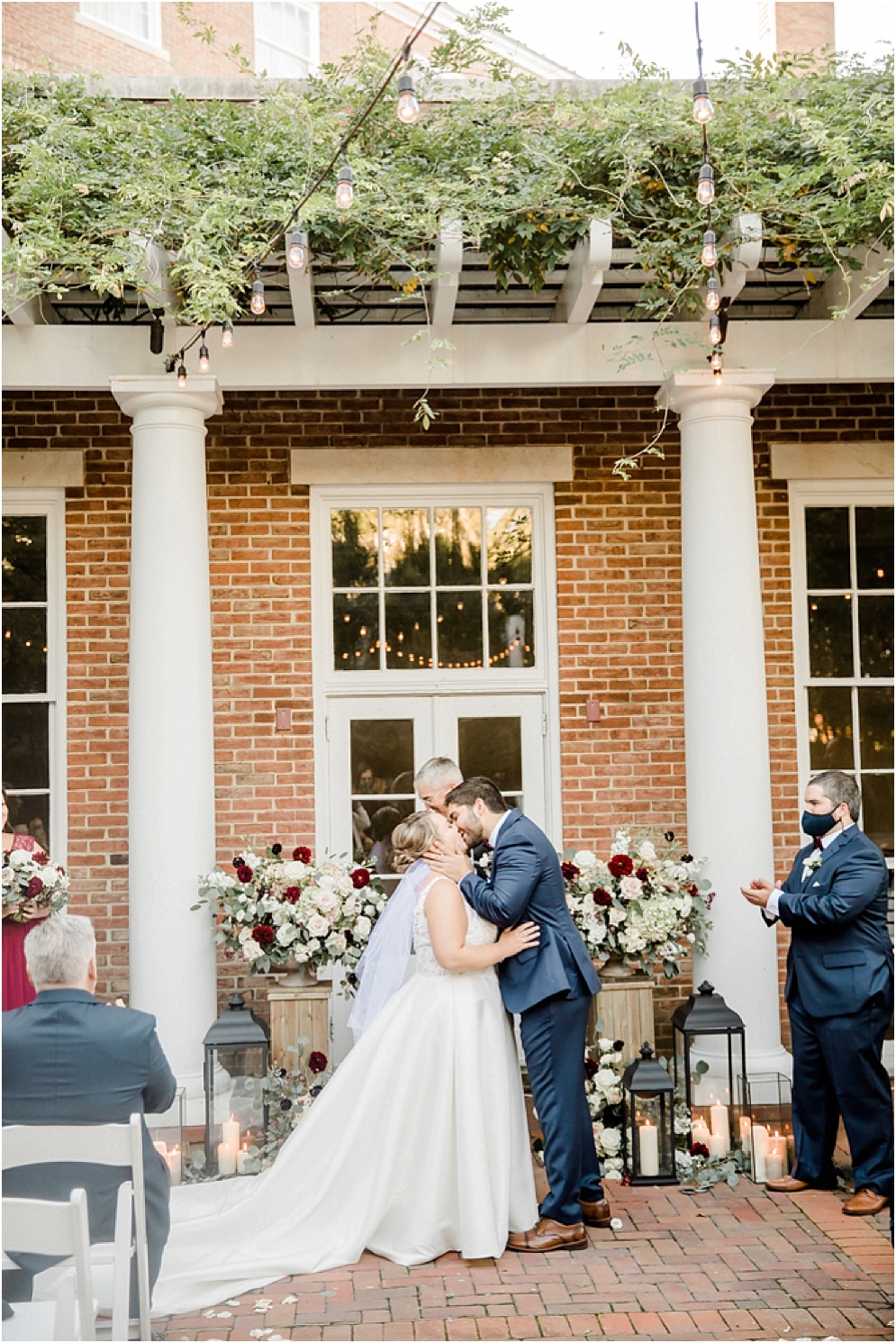 An Eastern Shore wedding in Downtown Easton, featuring deep red and purple hues and an incredibly joyful couple.