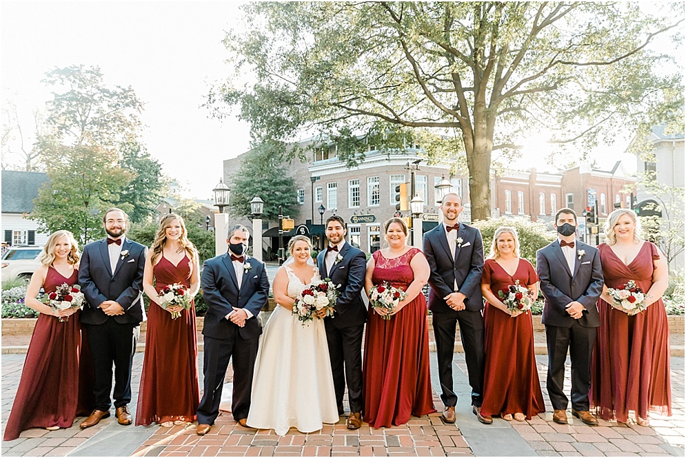 An Eastern Shore wedding in Downtown Easton, featuring deep red and purple hues and an incredibly joyful couple.