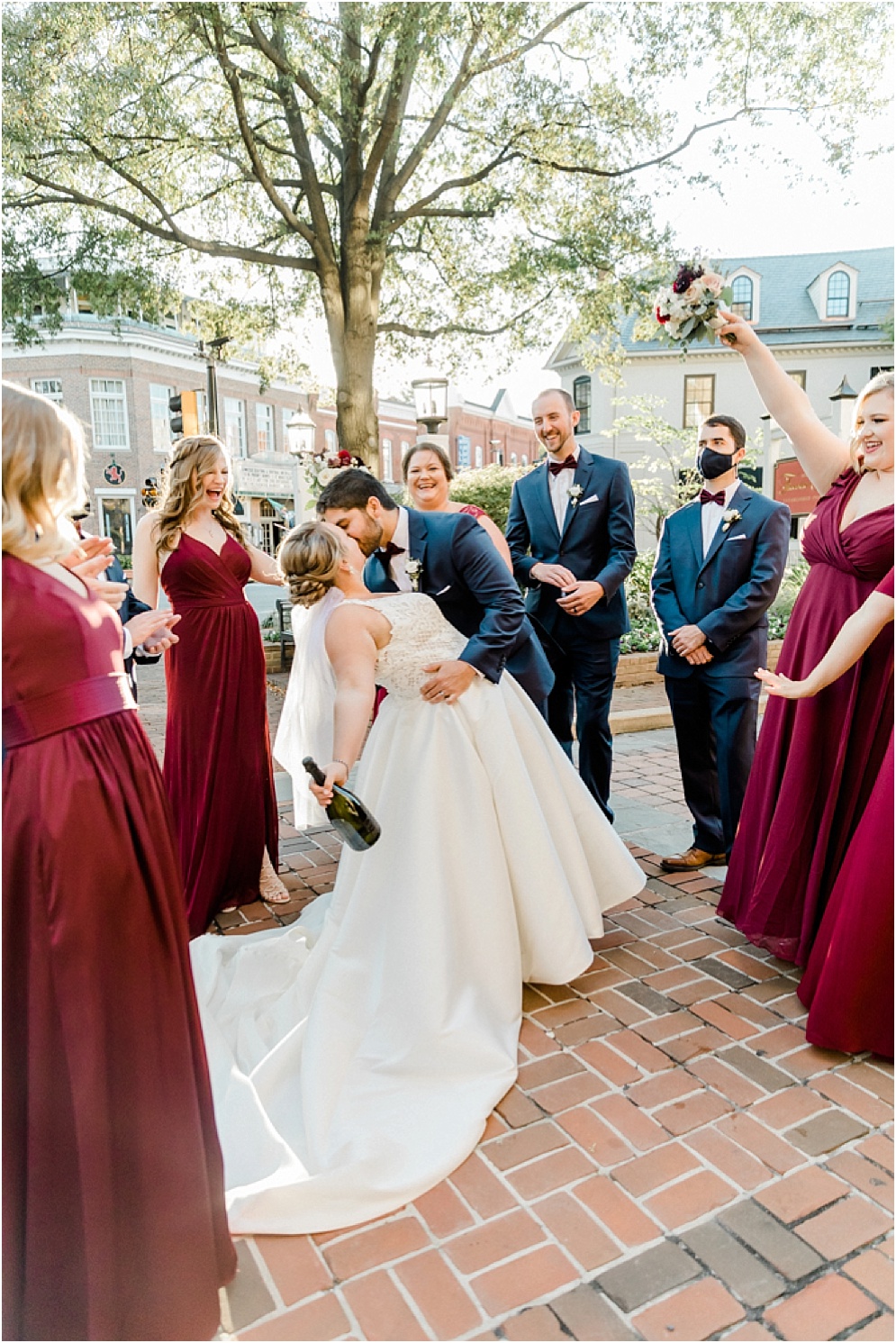 An Eastern Shore wedding in Downtown Easton, featuring deep red and purple hues and an incredibly joyful couple.