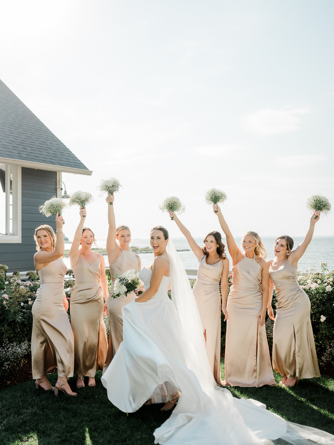 A classic, elegant waterfront wedding with gold bridesmaid dresses on the Chesapeake Bay in Maryland.