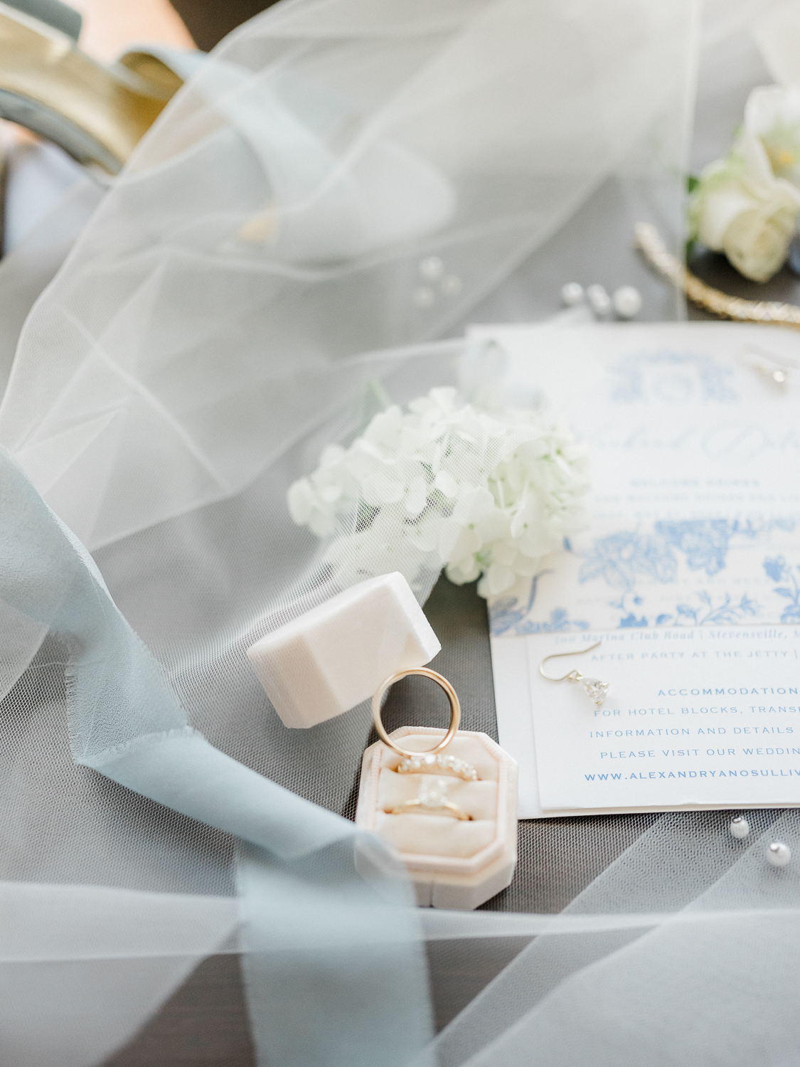 A white and baby blue coastal, chic wedding with romantic touches on the Chesapeake Bay on the Eastern Shore of Maryland.