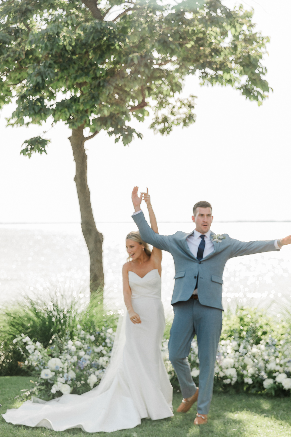 A white and baby blue coastal, chic wedding with romantic touches on the Chesapeake Bay on the Eastern Shore of Maryland.