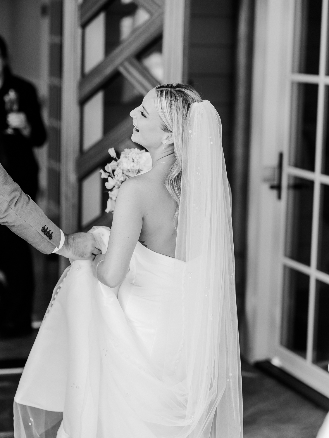 A white and baby blue coastal, chic wedding with romantic touches on the Chesapeake Bay on the Eastern Shore of Maryland.