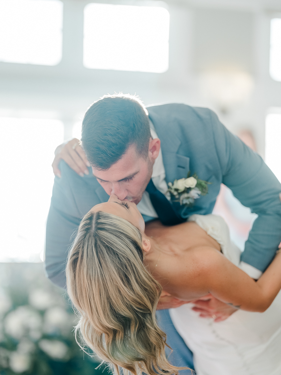 A white and baby blue coastal, chic wedding with romantic touches on the Chesapeake Bay on the Eastern Shore of Maryland.